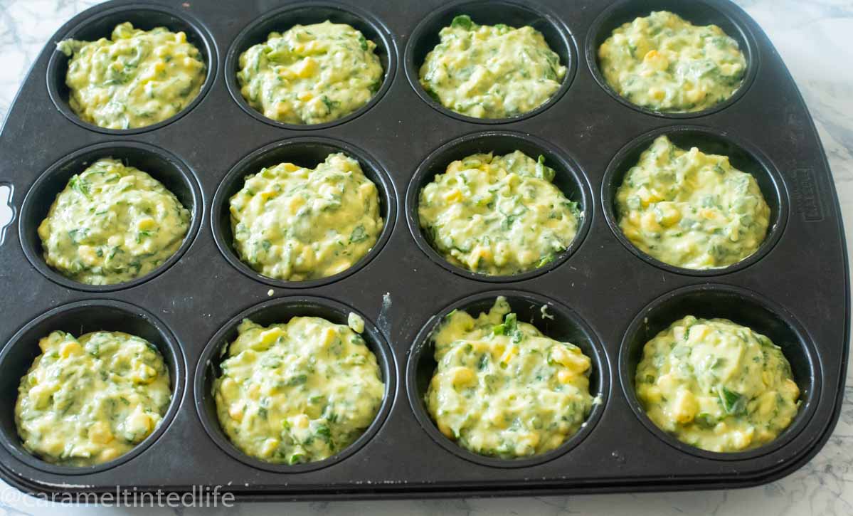 Corn and Spinach Muffins lying in  a tray