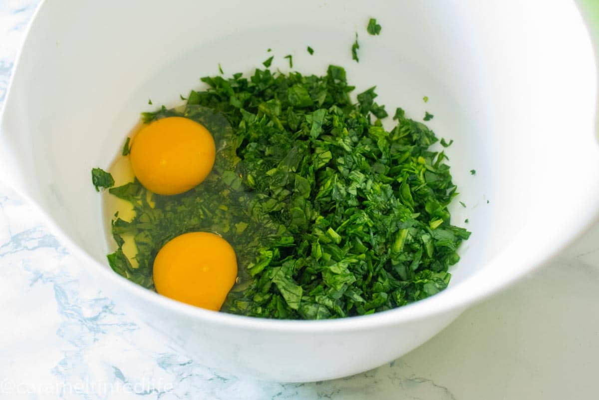 Savory Corn and Spinach Muffins lying in a tray