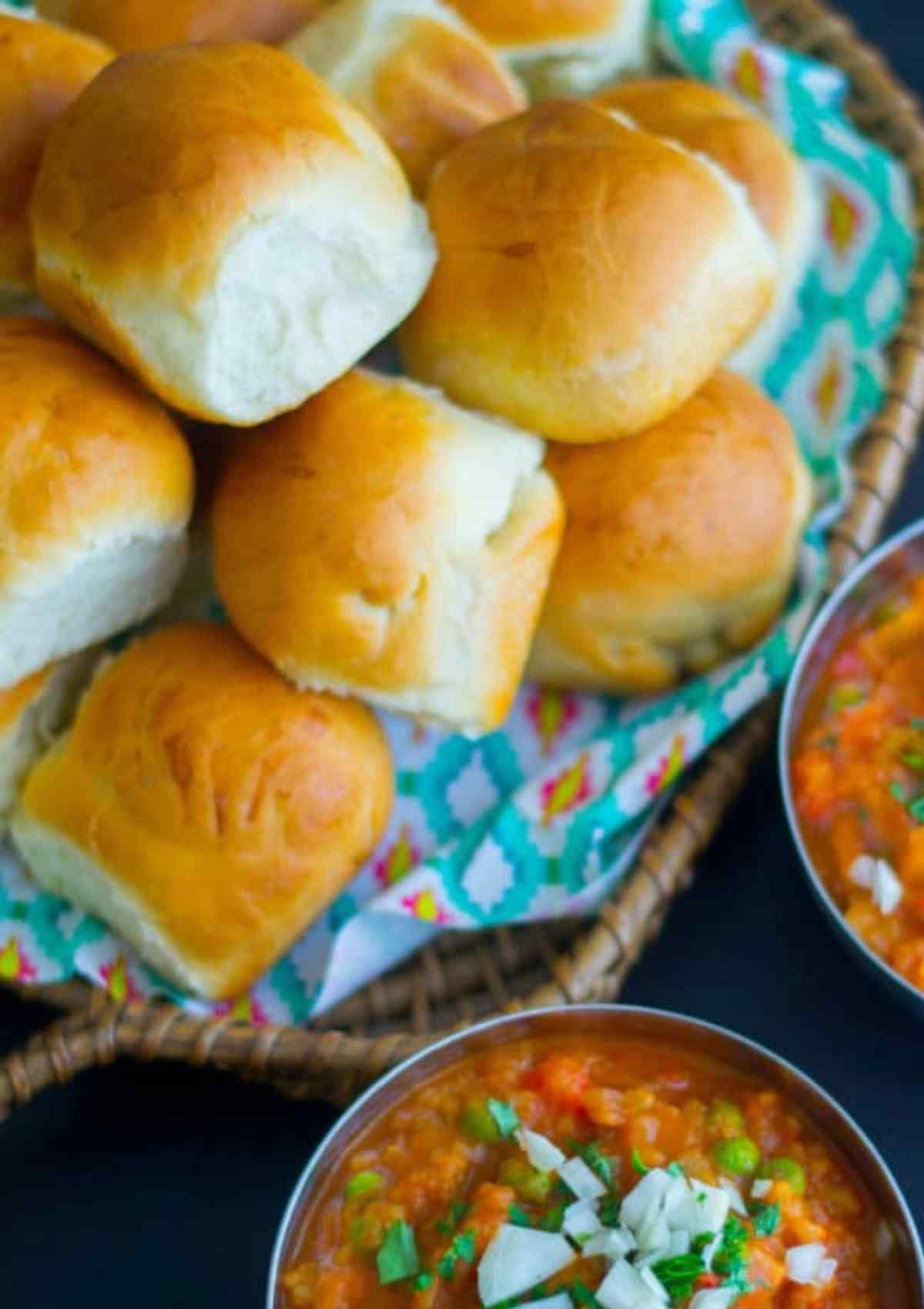 Pav bread on a plate next to the bhaji 