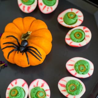 Halloween Deviled Eggs with a pumpkin and spider