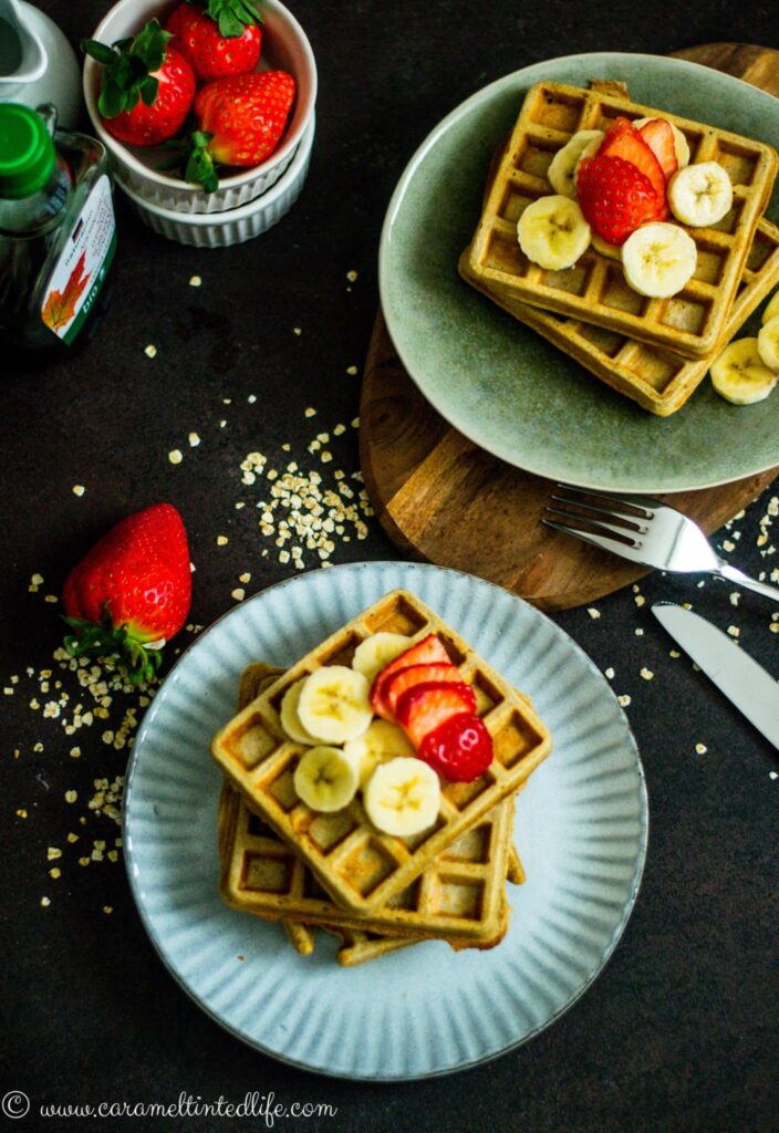 Waffles with bananas, strawberries on a plate