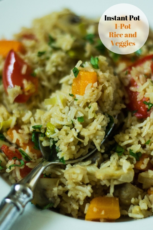 Instant Pot Rice and vegetables with a spoon 