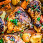Close up of chicken thighs and legs in a roasting pan