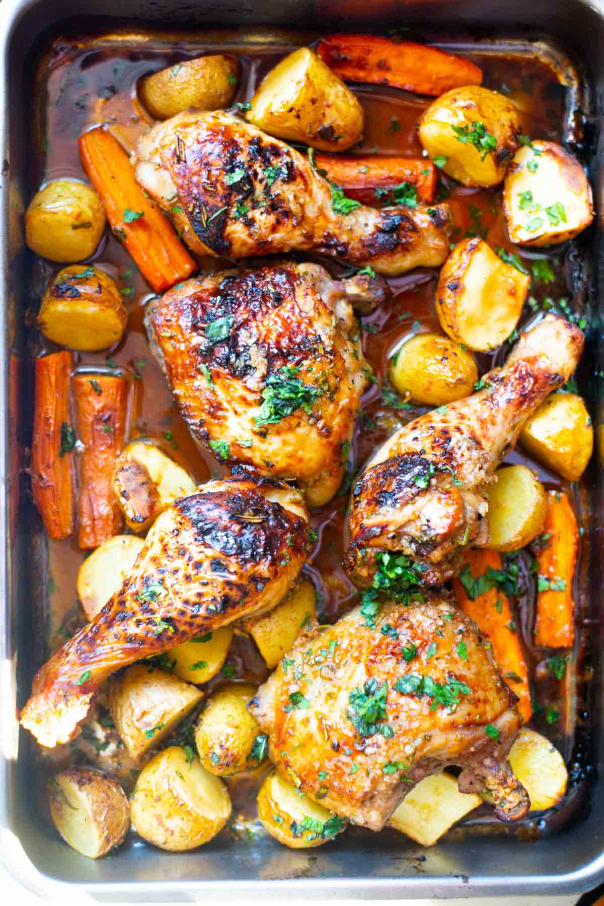 Top view of a roasting pan with honey garlic chicken 