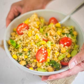 Bulgur Salad with chickpeas, cherry tomatoes, cucumber, served in a bowl