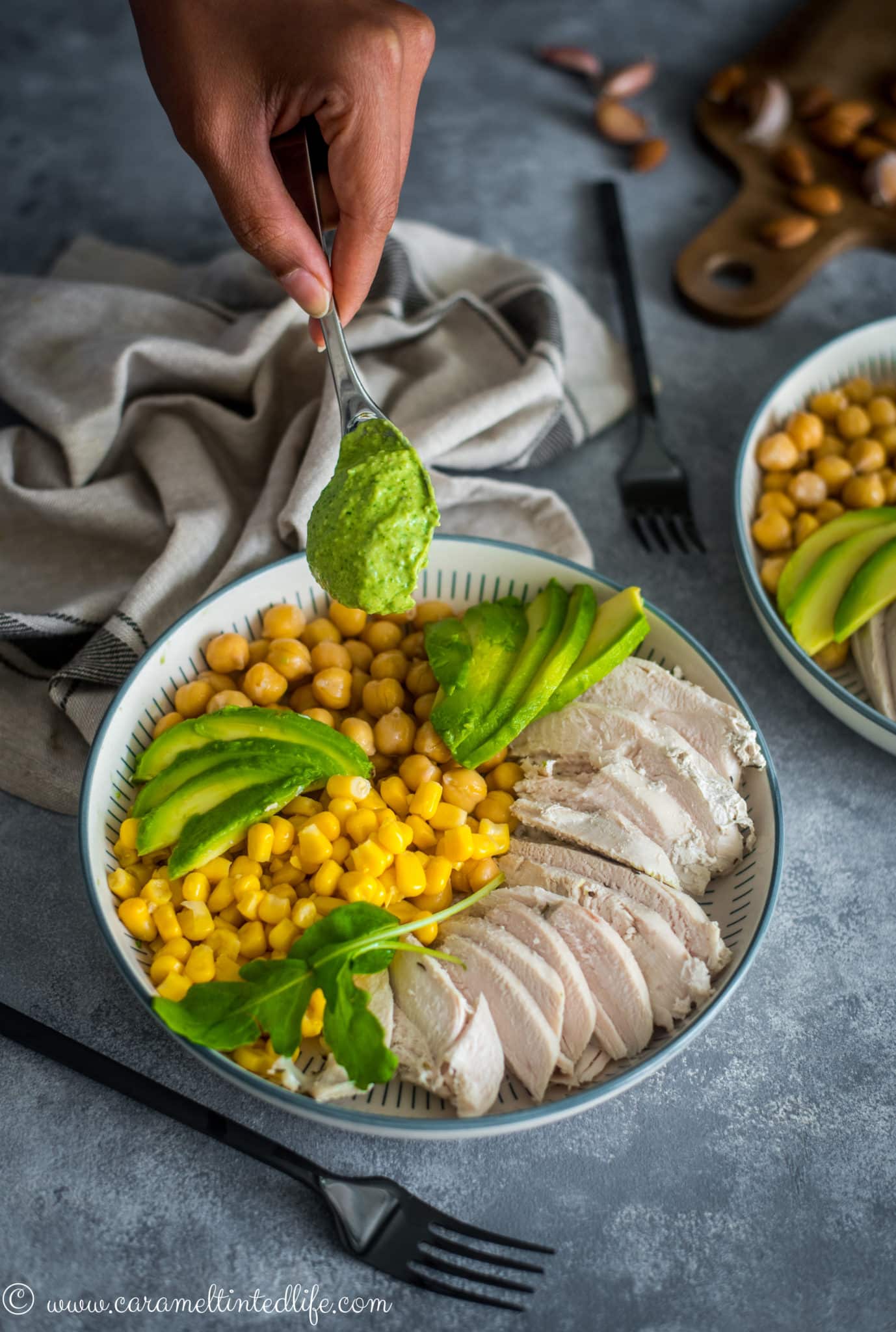 chicken salad with green goddess dressing in a bowl with a fork