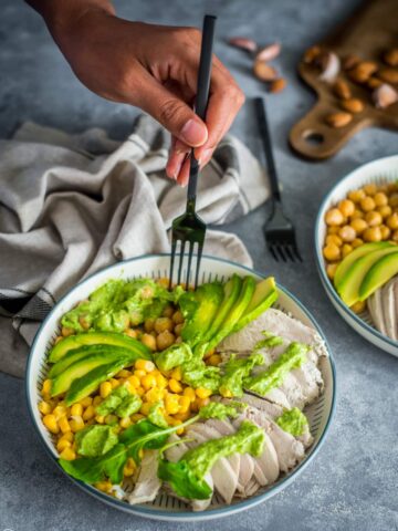 Green Goddess Chicken Salad in a bowl with a fork