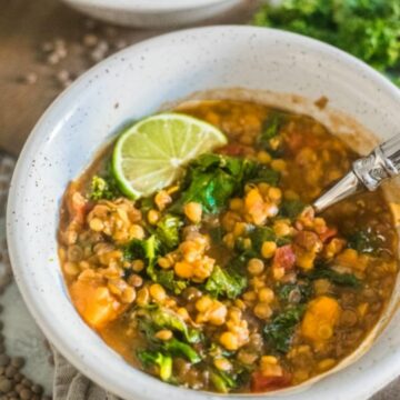 Instant Pot Lentil Soup with Kale and Sweet Potato in a bowl with a spoon