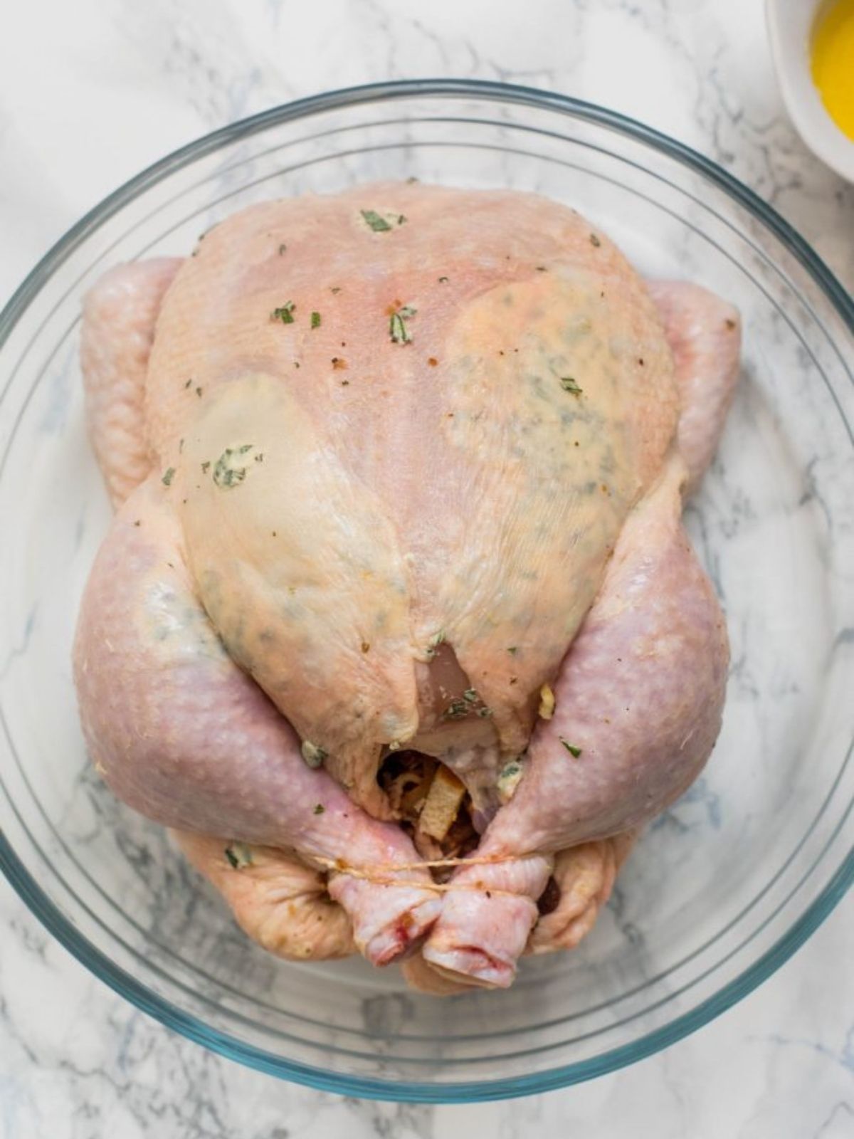 Preparing a Roast Chicken with Herbs and Spices 