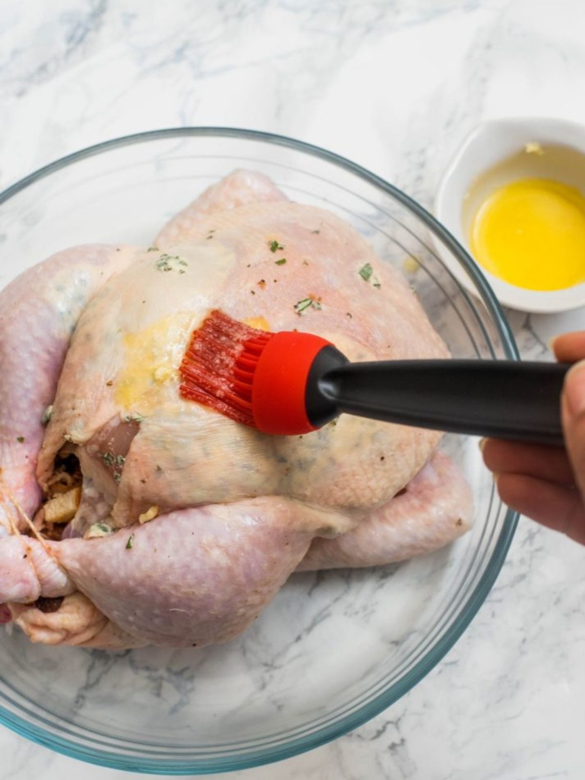 Preparing a Roast Chicken with Herbs and Spices 