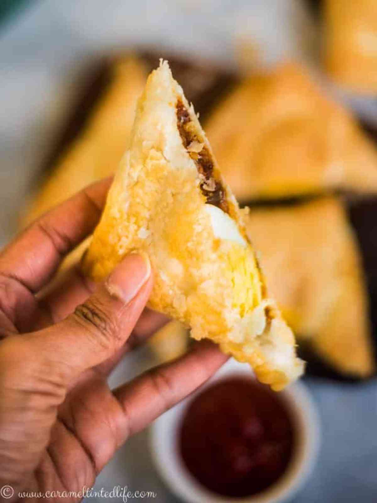 Sliced egg puffs held in a hand