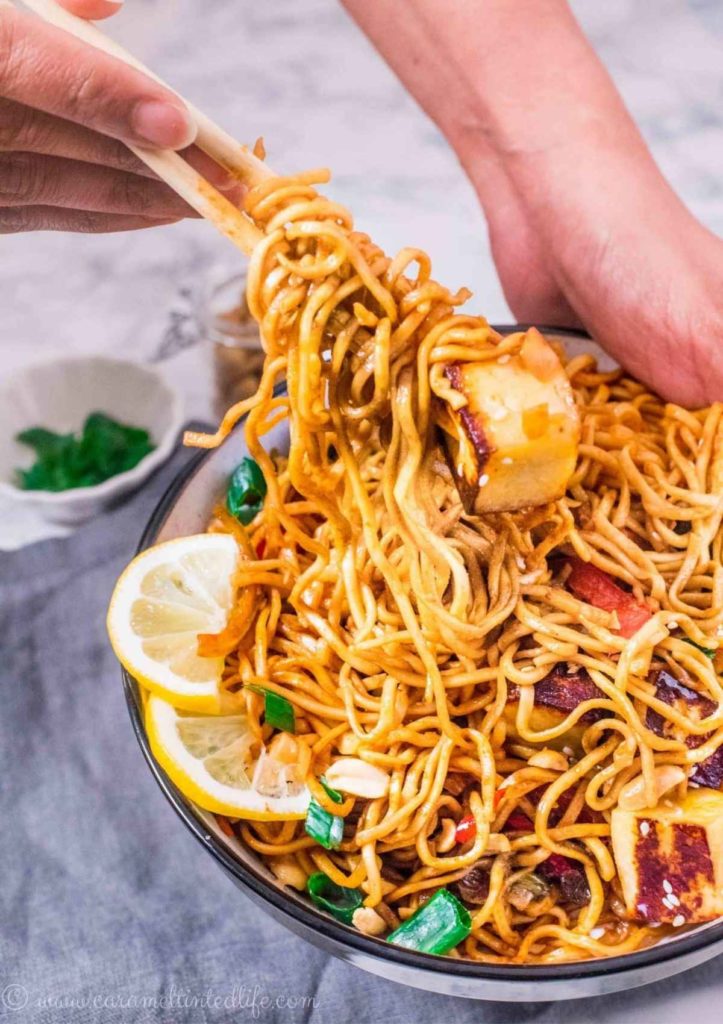 Noodle bowl being served with chopsticks
