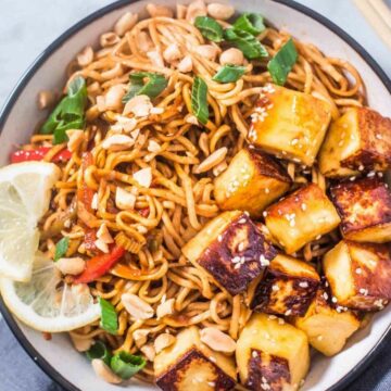 Noodle bowl with noodles, paneer, peanuts, stir-fried veggies