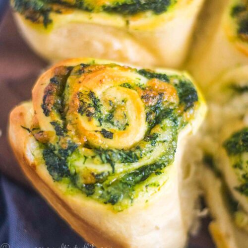 Homemade bread rolls on a serving board