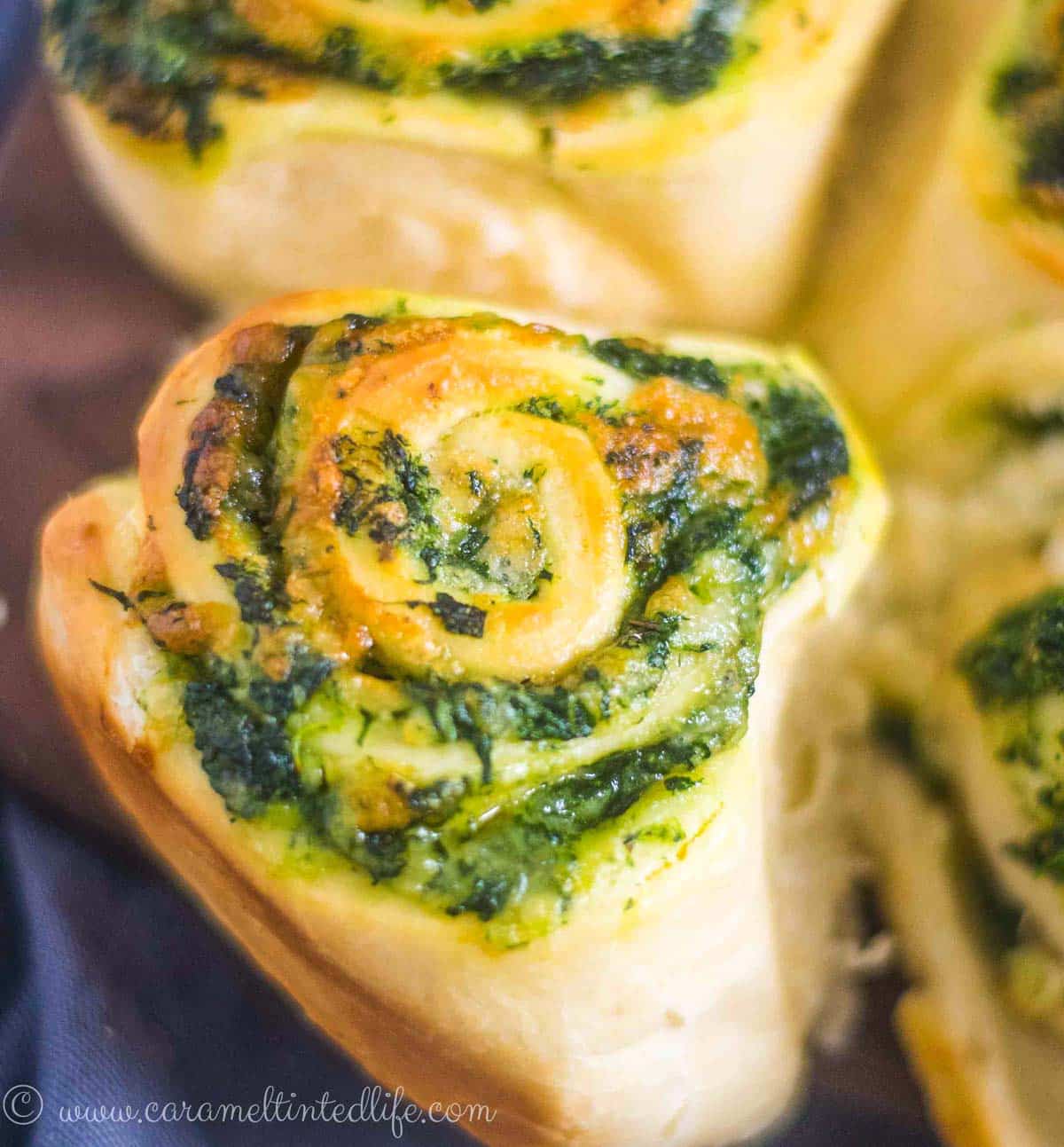 Closeup of a spinach and cheese stuffed bread roll