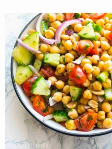 chickpea salad in a bowl with a fork