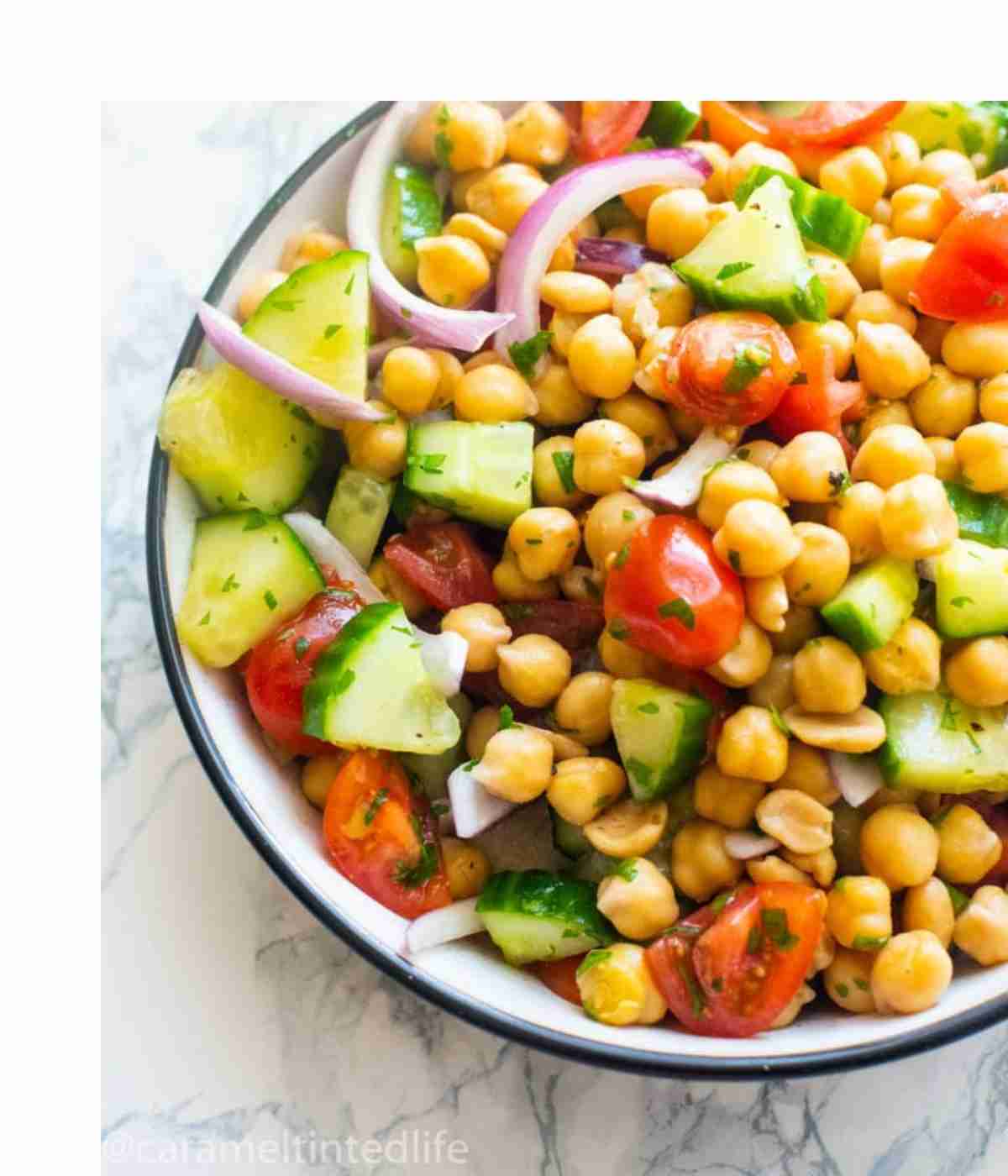 chickpea salad in a bowl with a fork