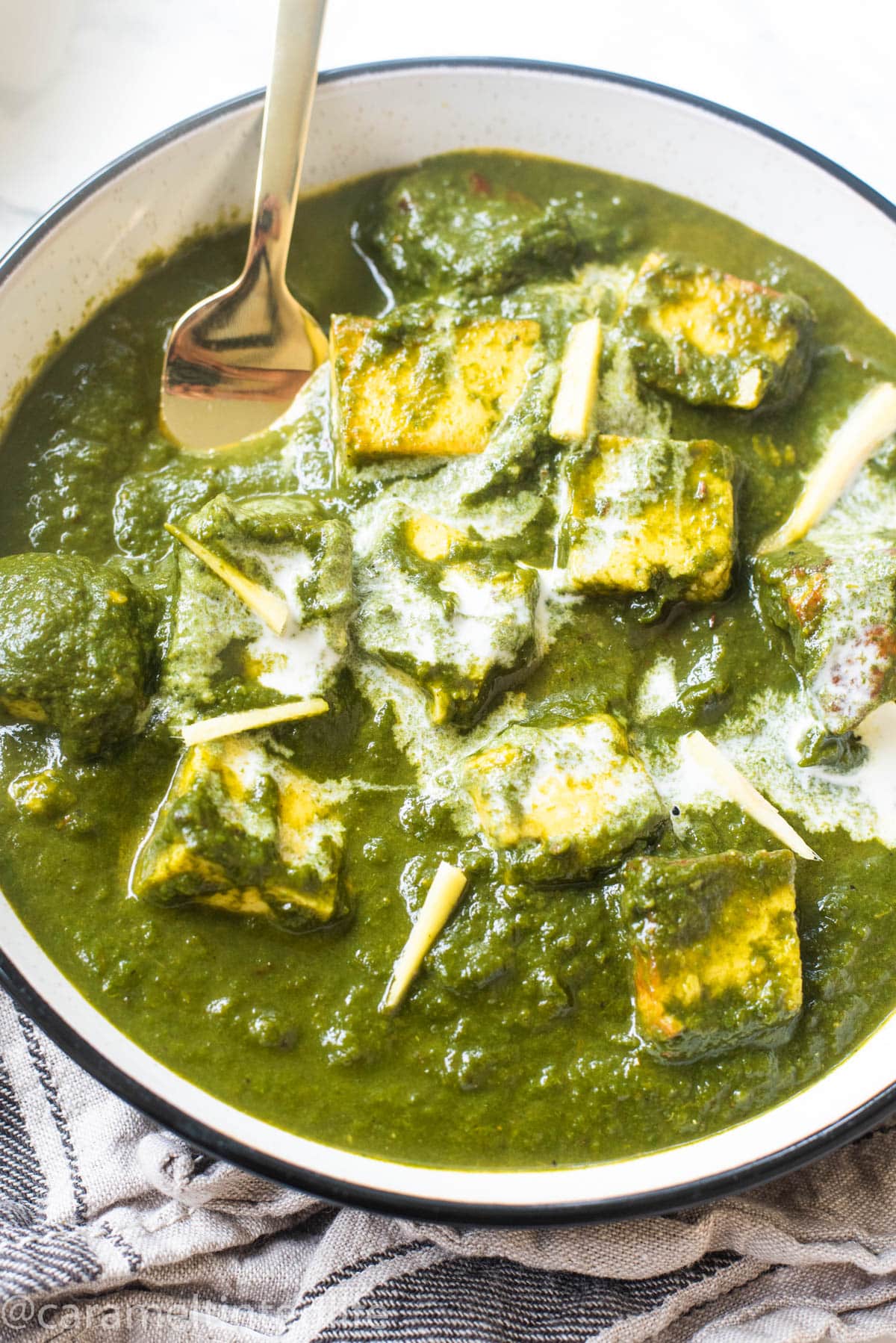 Close up view of saag paneer in a bowl