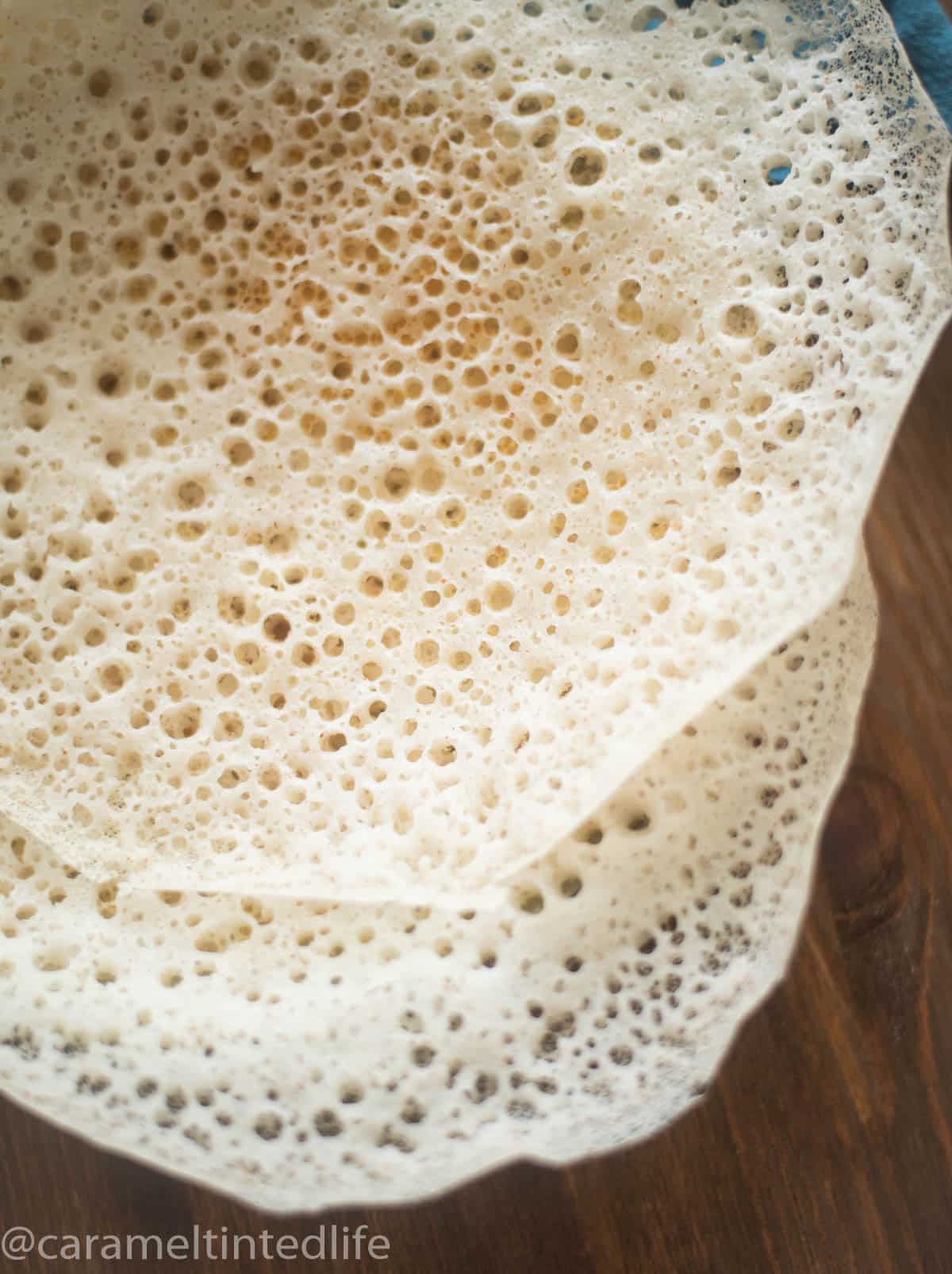 Close up of the lace-like edges of appams