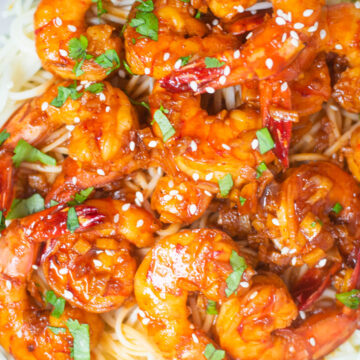 Prawns in honey garlic chili sauce on a bed of noodles