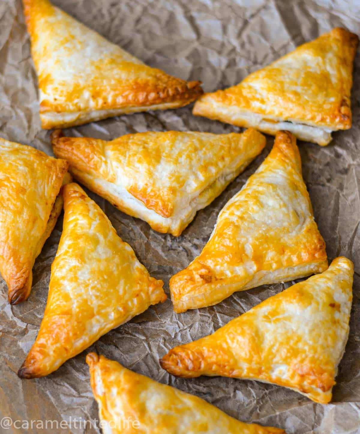 Golden brown puff pastry samosas out of the oven