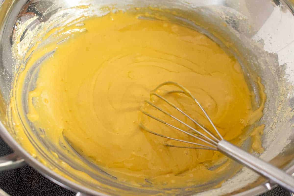 Whisking in chickpea flour with sugar mixture