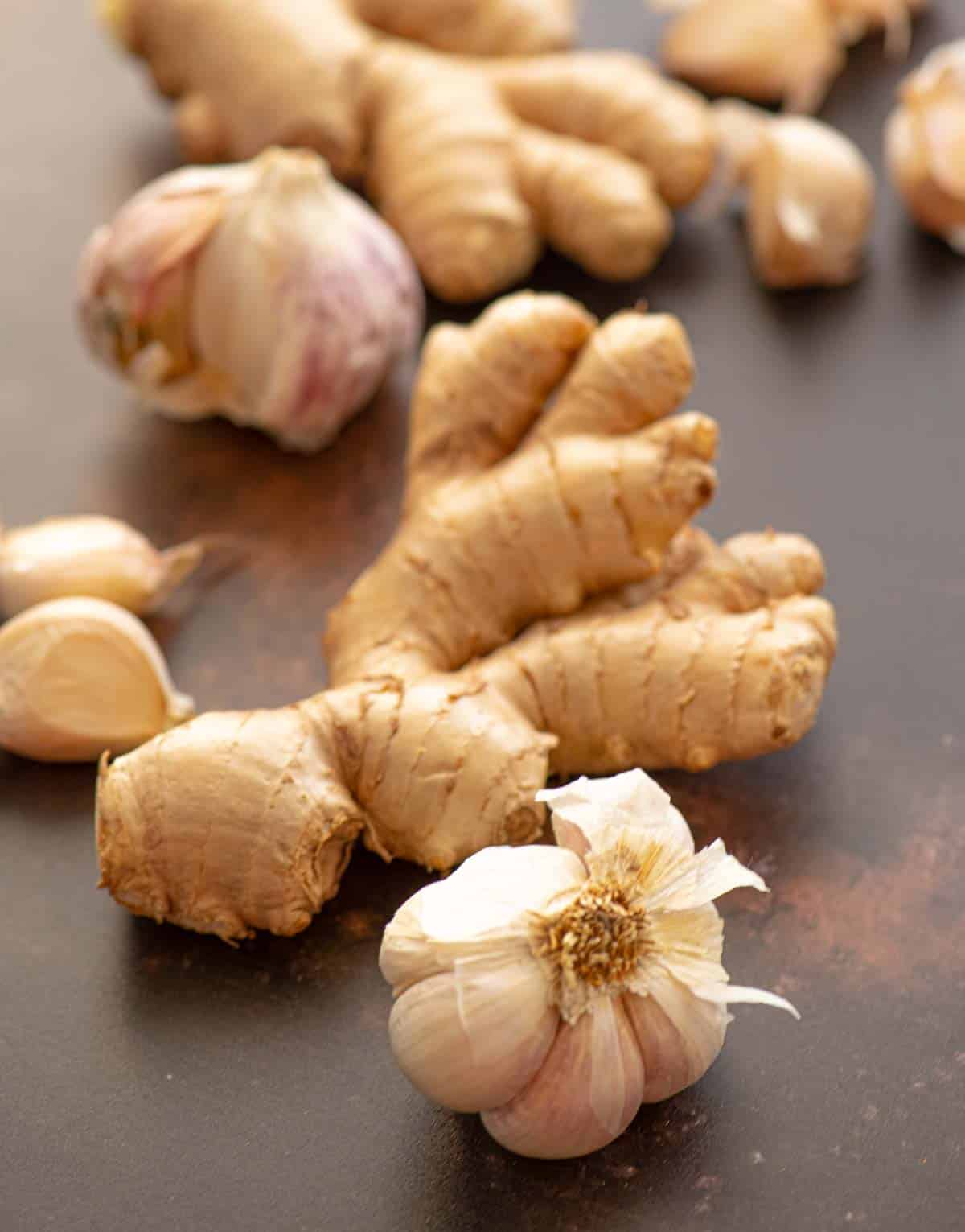 ginger and garlic on a brown surface