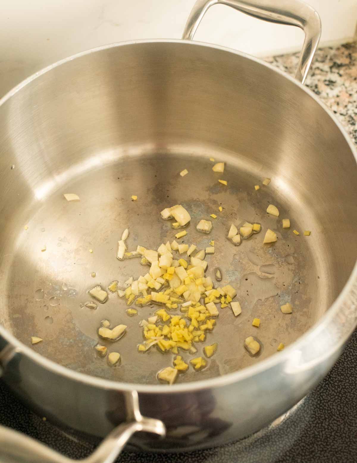 Garlic and ginger in a pot on the stovetop