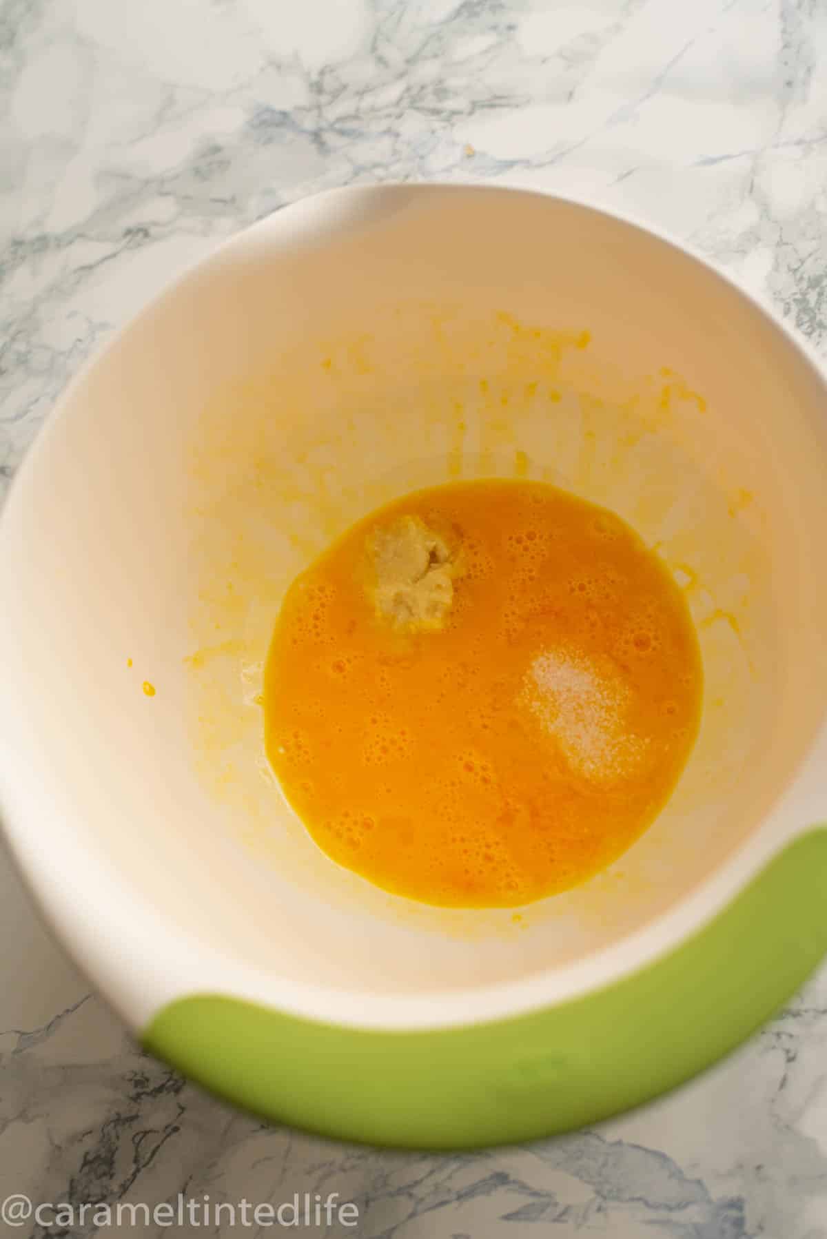Beaten egg and ginger garlic paste in a bowl