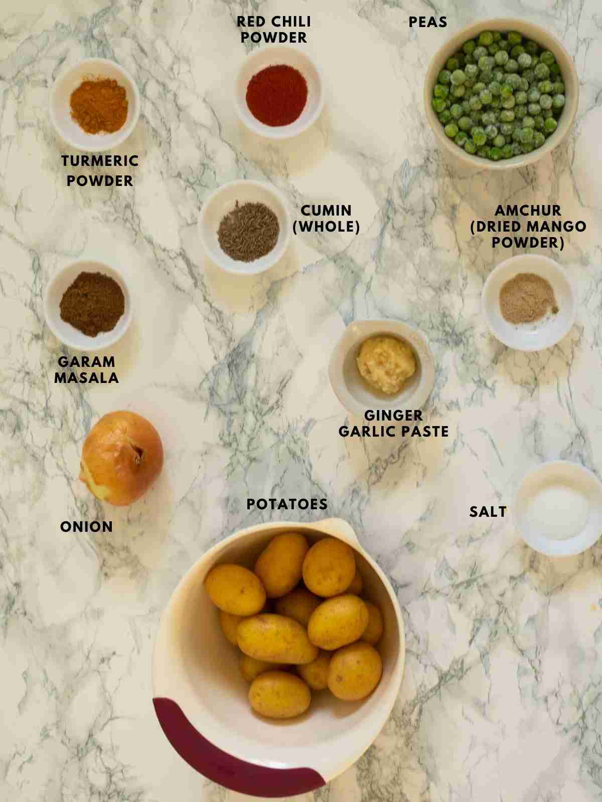 All ingredients used to make aloo matar curry