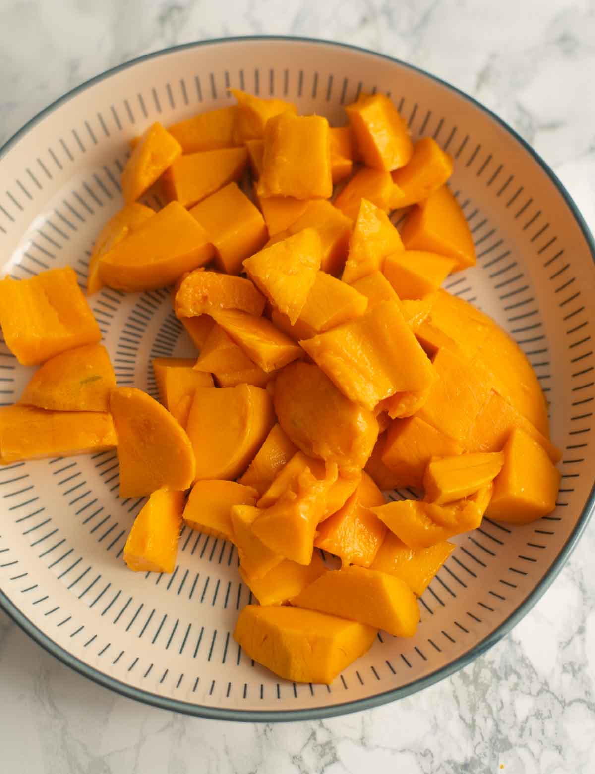 Sliced mango pieces on a plate