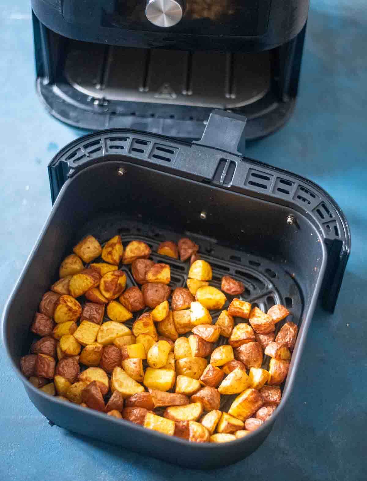 crispy air fried potatoes in air fryer basket