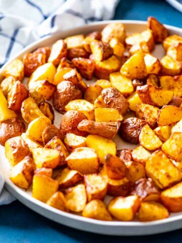 close up of air fried potatoes in a plate