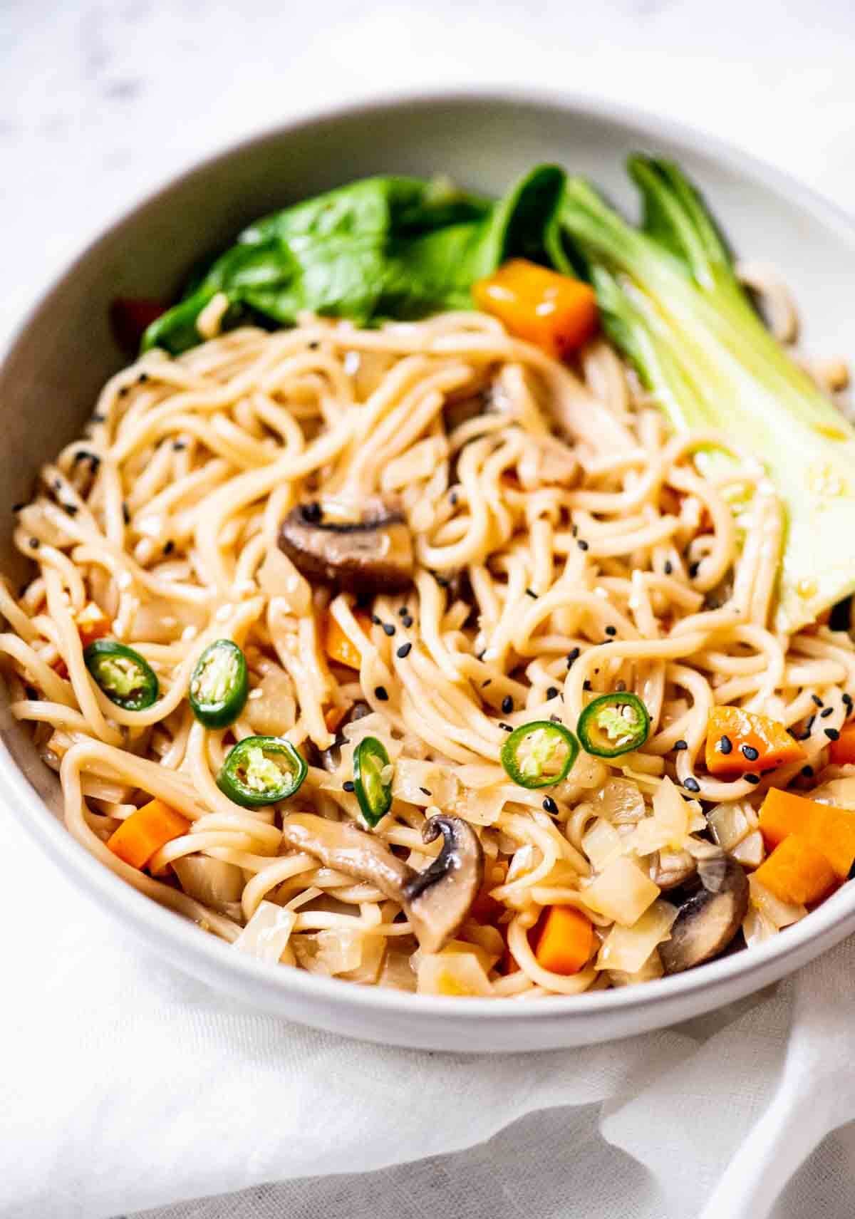 whote bowl with noodles and veggies