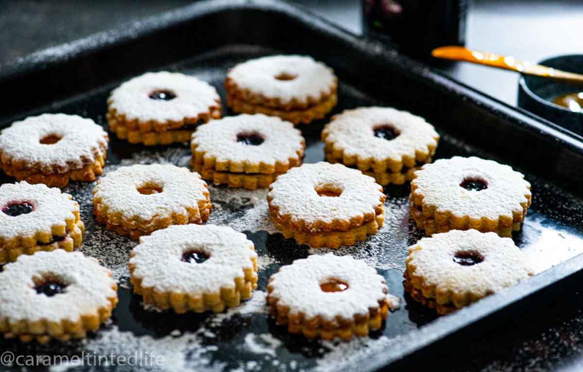 linzer cookies on a baking sheet