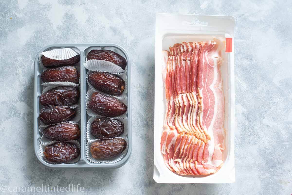 mejdool dates and bacon on a grey backbackdrop
