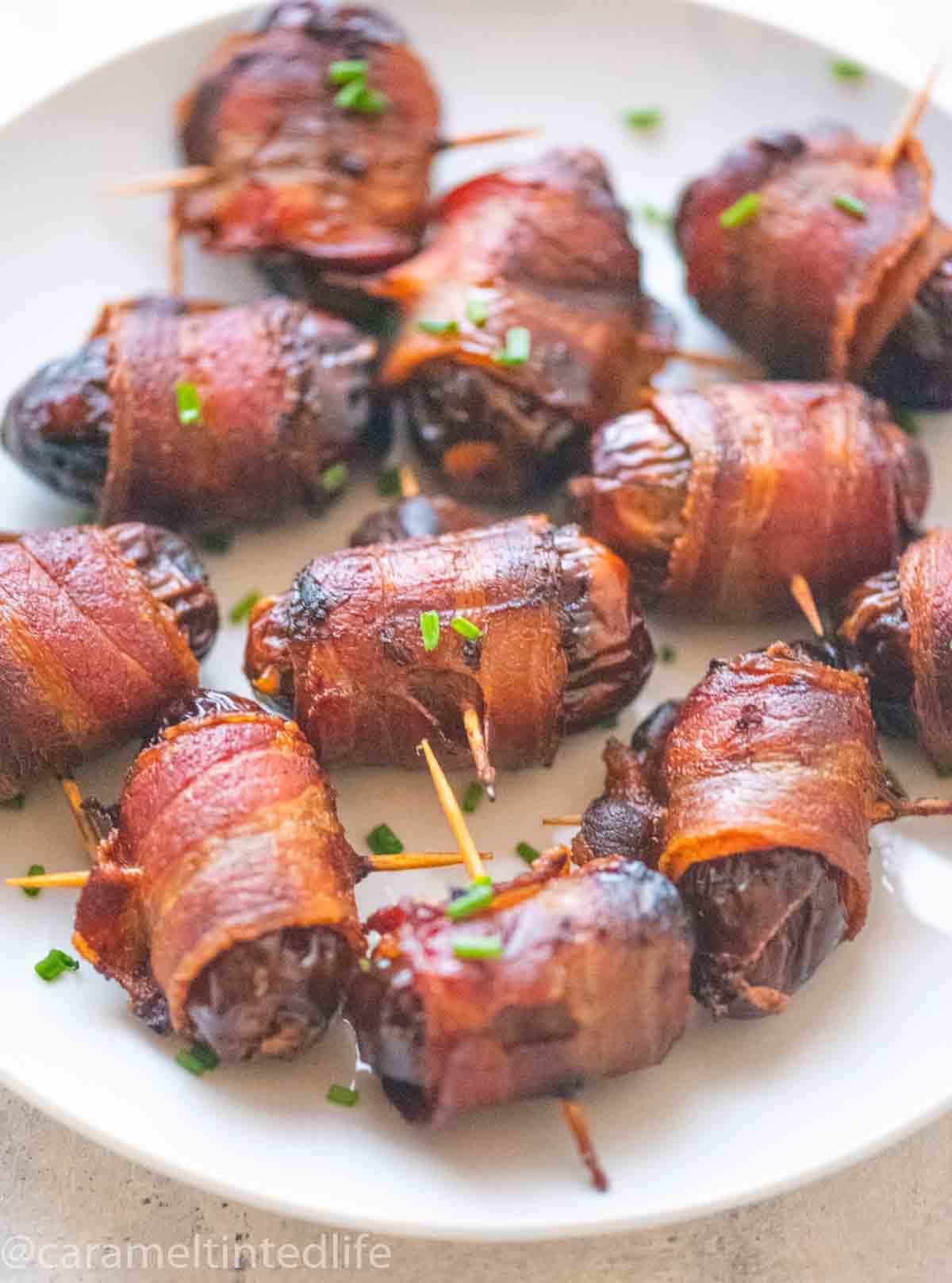 close up of bacon wrapped around dates