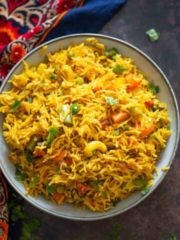 top view of vegetable pulao on a plate