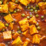 close up of mattar and paneer in a gravy